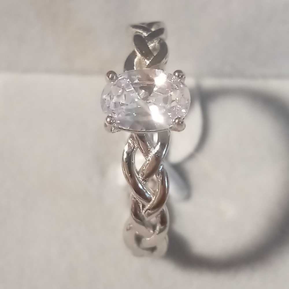 Oval cut CZ With a braided band. Perfect engagement or promise ring.